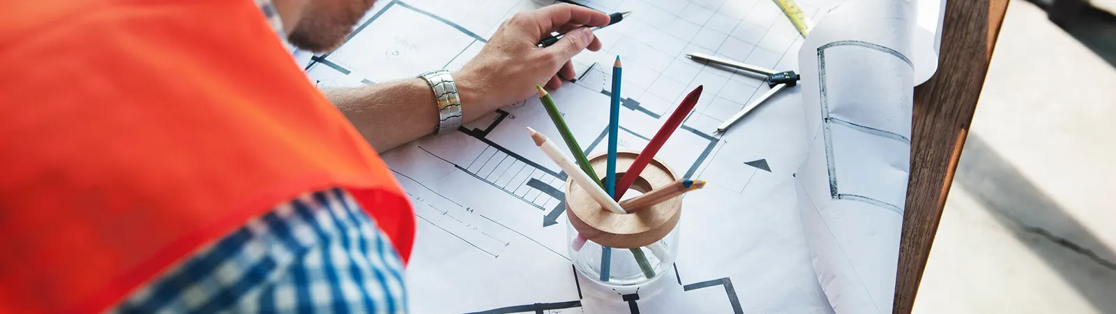 Man studying architectural plans