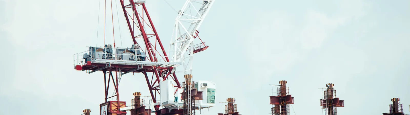 Red and white construction crane